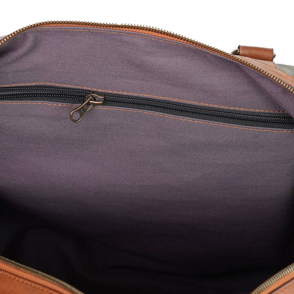 Inside view of VALANTI olive green canvas duffle bag showing storage compartment