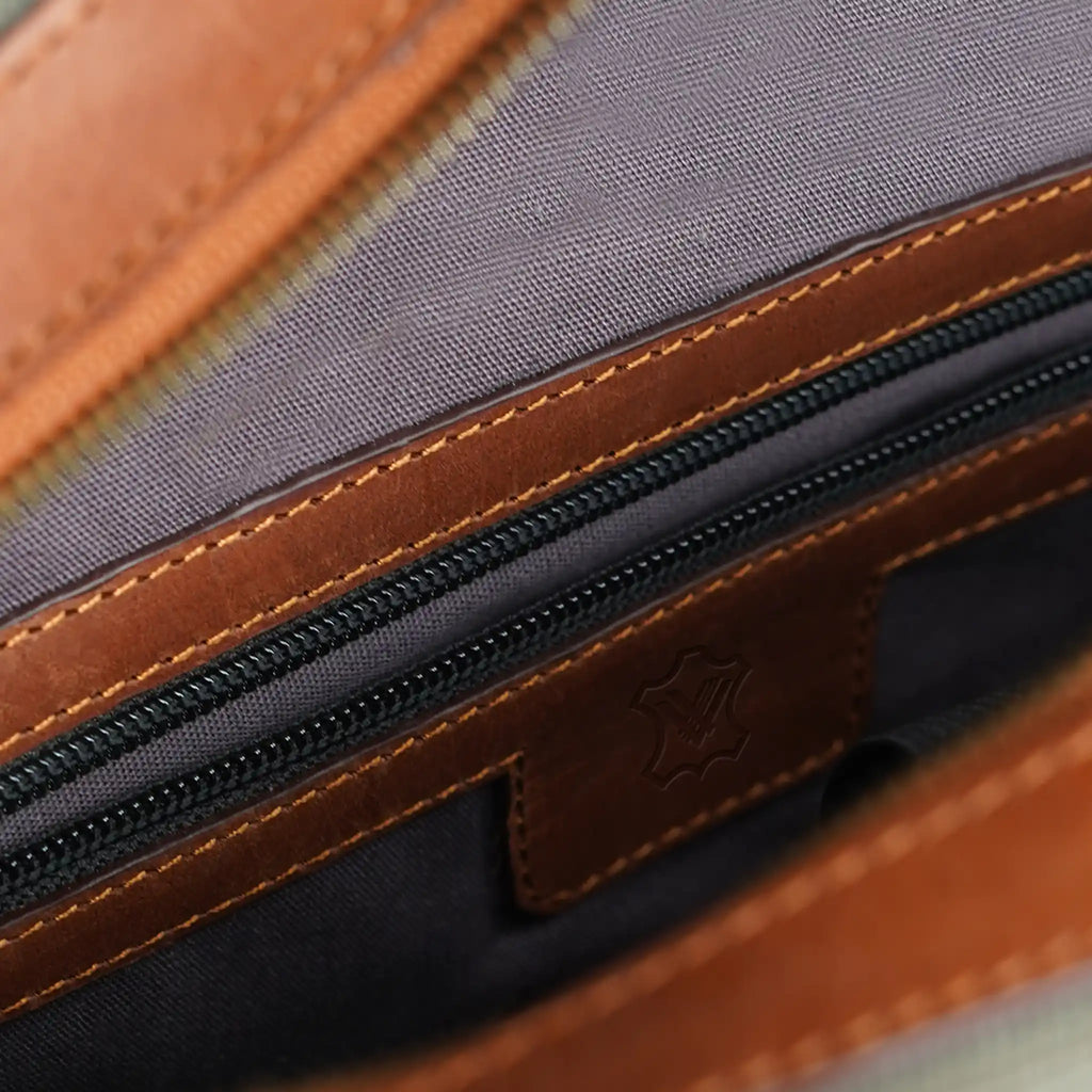 Canvas laptop backpack interior with secure zip pocket and organised storage